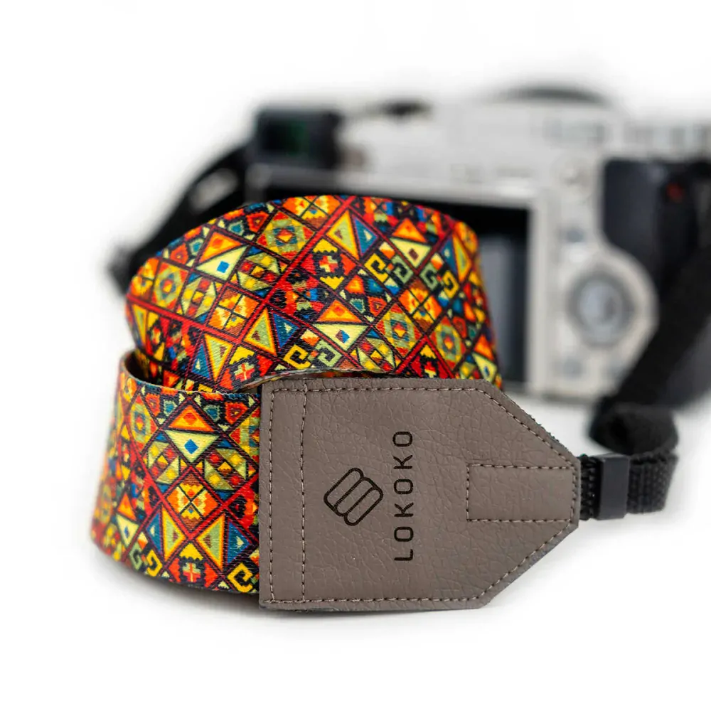 Popruh na fotoaparát - Rebus